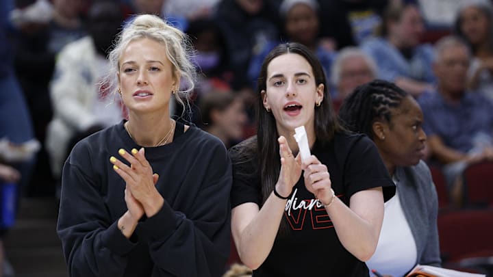 Jun 7, 2025; Chicago, Illinois, USA; Injured Indiana Fever guard Sophie Cunningham (8) and guard Caitlin Clark (22) react from the bench during the first half of a WNBA game against the Chicago Sky at United Center. Mandatory Credit: Kamil Krzaczynski-Imagn Images