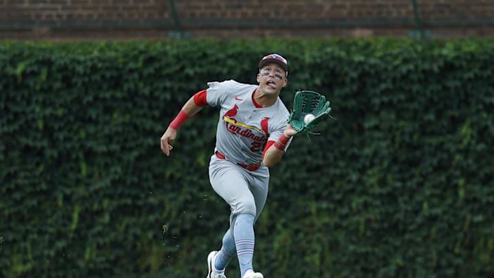 Jul 4, 2025; Chicago, Illinois, USA; St. Louis Cardinals left fielder Lars Nootbaar (21) catches a fly ball hit by Chicago Cubs catcher Carson Kelly during the third inning at Wrigley Field. Mandatory Credit: Kamil Krzaczynski-Imagn Images