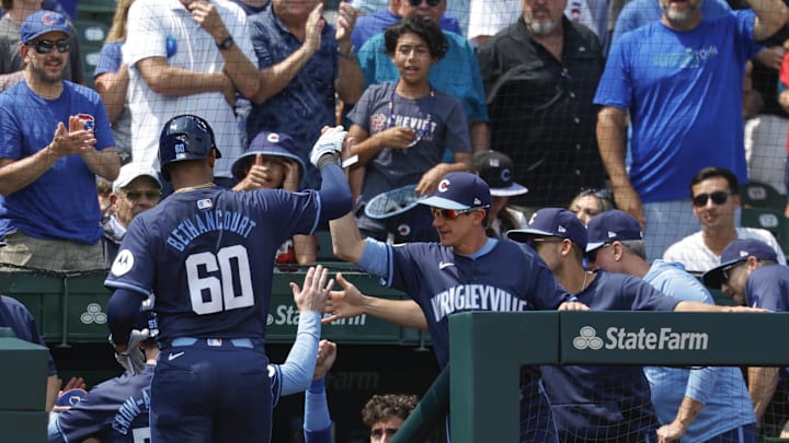 Aug 2, 2024; Chicago, Illinois, USA; Chicago Cubs catcher Christian Bethancourt (60) celebrates with manager Craig Counsell (middle) after hitting a three run home run against the St. Louis Cardinals during the second inning at Wrigley Field.