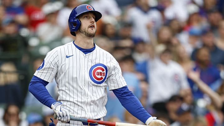 Apr 18, 2025; Chicago, Illinois, USA; Chicago Cubs outfielder Kyle Tucker (30) hits a two-run home run against the Arizona Diamondbacks during the eighth inning at Wrigley Field. 
