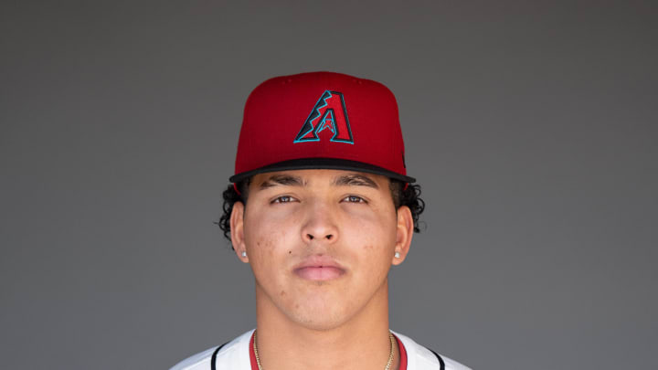 Feb 21, 2024; Scottsdale, AZ, USA; Arizona Diamondbacks pitcher Cristian Mena (64) poses for a picture for MLB media day at Salt River Fields. Mandatory Credit: Allan Henry-USA TODAY Sports