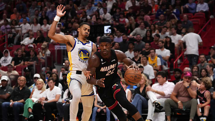 Nov 1, 2022; Miami, Florida, USA; Miami Heat forward Jimmy Butler (22) dribbles the ball around Golden State Warriors guard Jordan Poole (3) during the second half at FTX Arena. Mandatory Credit: Jasen Vinlove-Imagn Images