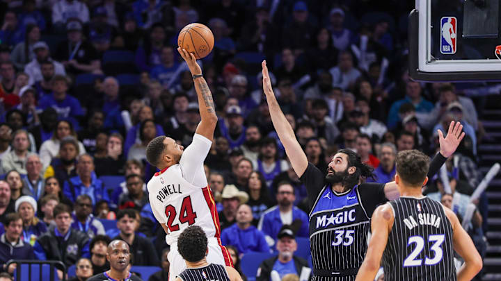 Dec 9, 2025; Orlando, Florida, USA; Miami Heat guard Norman Powell (24) shoots against Orlando Magic center Goga Bitadze (35) during the second half at Kia Center. Mandatory Credit: Mike Watters-Imagn Images Dec 9, 2025; Orlando, Florida, USA; Miami Heat guard Norman Powell (24) shoots against Orlando Magic center Goga Bitadze (35) during the second half at Kia Center. Mandatory Credit: Mike Watters-Imagn Images