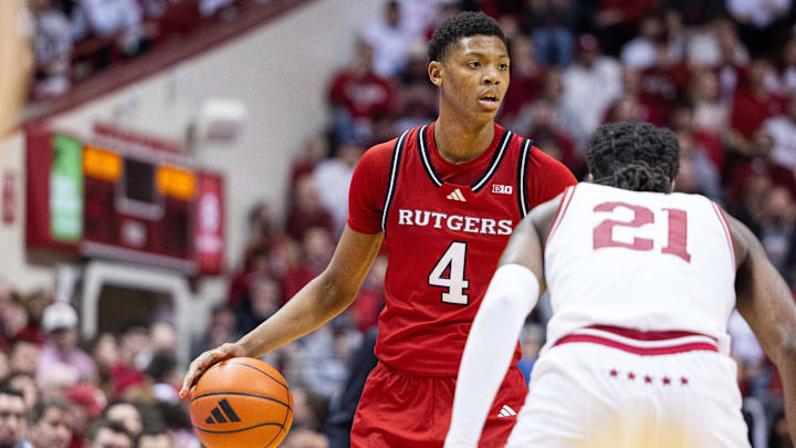 Jan 2, 2025; Bloomington, Indiana, USA; Rutgers Scarlet Knights guard Ace Bailey (4) dribbles the ball while Indiana Hoosiers forward Mackenzie Mgbako (21) defends in the second half at Simon Skjodt Assembly Hall. Mandatory Credit: Trevor Ruszkowski-Imagn Images
