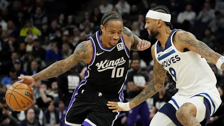 Feb 3, 2025; Minneapolis, Minnesota, USA; Sacramento Kings forward DeMar DeRozan (10) works around Minnesota Timberwolves forward Nickeil Alexander-Walker (9) in the third quarter at Target Center. Mandatory Credit: Bruce Kluckhohn-Imagn Images
