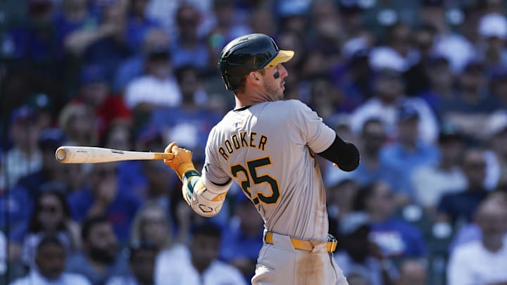 Oakland Athletics outfielder Brent Rooker (25) hits an RBI-single against the Chicago Cubs during the seventh inning at Wrigley Field in 2024.