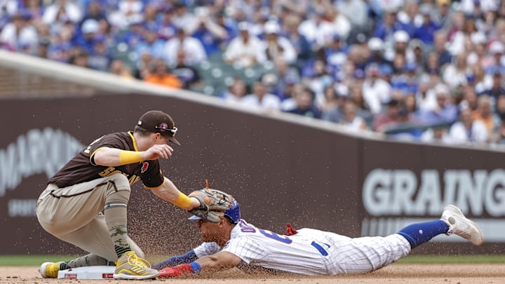 May 31, 2021; Chicago, Illinois, USA; San Diego Padres second baseman Jake Cronenworth (9) tags out at second base Chicago Cubs left fielder Rafael Ortega (66) during the eight inning at Wrigley Field. Mandatory Credit: Kamil Krzaczynski-Imagn Images May 31, 2021; Chicago, Illinois, USA; San Diego Padres second baseman Jake Cronenworth (9) tags out at second base Chicago Cubs left fielder Rafael Ortega (66) during the eight inning at Wrigley Field. Mandatory Credit: Kamil Krzaczynski-Imagn Images