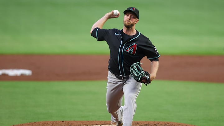 Jun 4, 2025; Atlanta, Georgia, USA; Arizona Diamondbacks starting pitcher Merrill Kelly (29) throws against the Atlanta Braves in the first inning at Truist Park. Mandatory Credit: Brett Davis-Imagn Images