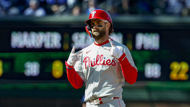 Apr 26, 2025; Chicago, Illinois, USA; Philadelphia Phillies first baseman Bryce Harper (3) celebrates after hitting a two-run double against the Chicago Cubs during the fourth inning at Wrigley Field. 