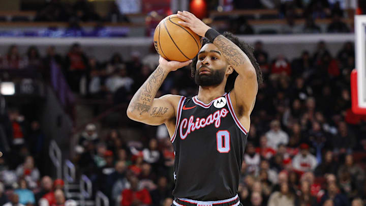 Jan 24, 2026; Chicago, Illinois, USA; Chicago Bulls guard Coby White (0)shoots against the Boston Celtics during the first half at United Center. Mandatory Credit: Kamil Krzaczynski-Imagn Images