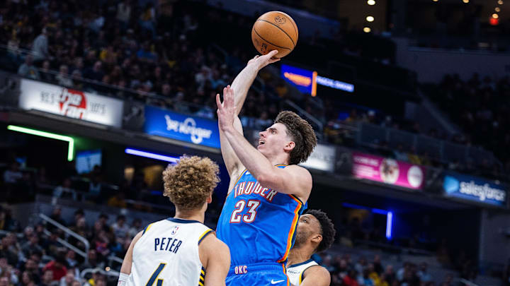 Oct 23, 2025; Indianapolis, Indiana, USA; Oklahoma City Thunder forward Brooks Barnhizer (23) shoots the ball while Indiana Pacers guard Taelon Peter (4) defends in the first half at Gainbridge Fieldhouse. Mandatory Credit: Trevor Ruszkowski-Imagn Images Oct 23, 2025; Indianapolis, Indiana, USA; Oklahoma City Thunder forward Brooks Barnhizer (23) shoots the ball while Indiana Pacers guard Taelon Peter (4) defends in the first half at Gainbridge Fieldhouse. Mandatory Credit: Trevor Ruszkowski-Imagn Images