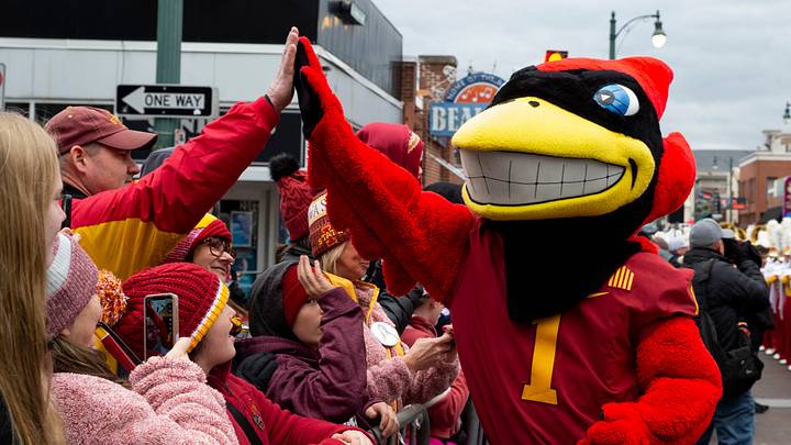 Iowa State mascot Cy the Cardinal high fives fans during the Beale Street Parade for Iowa State University and University of Memphis in Downtown Memphis, Tenn., on Thursday, December 28, 2023. Iowa State will play Memphis in the AutoZone Liberty Bowl on Friday. Iowa State mascot Cy the Cardinal high fives fans during the Beale Street Parade for Iowa State University and University of Memphis in Downtown Memphis, Tenn., on Thursday, December 28, 2023. Iowa State will play Memphis in the AutoZone Liberty Bowl on Friday.