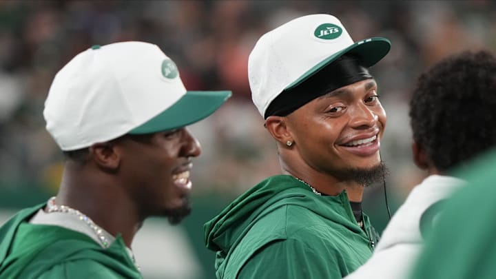 East Rutherford, NJ -- August 22, 2025 -- Breece Hall of the Jets and Justin Fields in the first half. The Philadelphia Eagles came to MetLife Stadium to play the NY Jets in the final preseason season game.