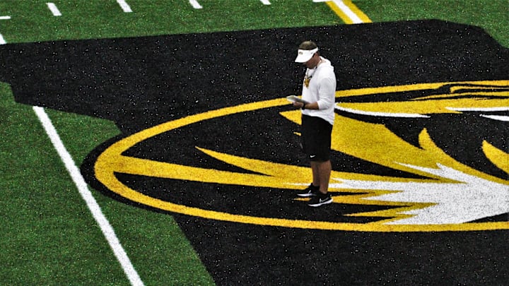 Missouri head coach Eli Drinkwitz stands at the center of the Stephen's Indoor Facility football practice fields during a fall camp practice on Aug. 14, 2023, in Columbia, Mo. Missouri head coach Eli Drinkwitz stands at the center of the Stephen's Indoor Facility football practice fields during a fall camp practice on Aug. 14, 2023, in Columbia, Mo.