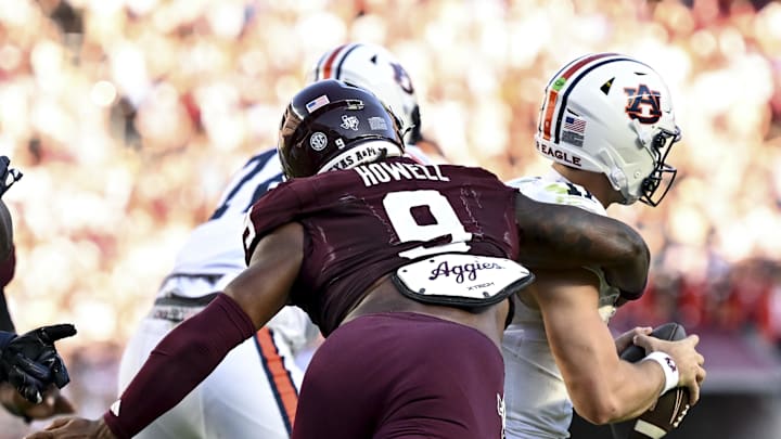Sep 27, 2025; College Station, Texas, USA; Texas A&M Aggies defensive end Cashius Howell (9) sacks Auburn Tigers quarterback Jackson Arnold (11) in the second half at Kyle Field. Mandatory Credit: Maria Lysaker-Imagn Images