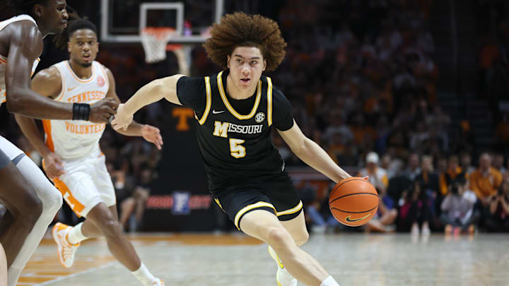 Feb 5, 2025; Knoxville, Tennessee, USA; Missouri Tigers guard T.O. Barrett (5) brings the ball up court against the Tennessee Volunteers during the second half at Thompson-Boling Arena at Food City Center. Mandatory Credit: Randy Sartin-Imagn Images