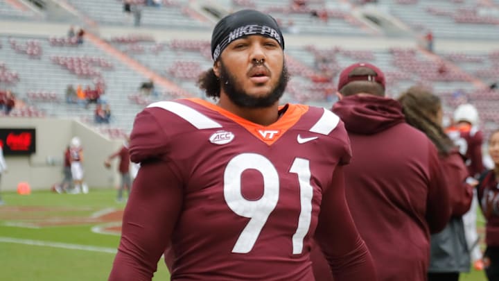 Oct 16, 2021; Blacksburg, Virginia, USA;  Virginia Tech Hokies tight end Wilfried Pene (91) walks on the field before the game against the Pittsburgh Panthers at Lane Stadium. Mandatory Credit: Reinhold Matay-Imagn Images