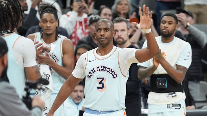 Dec 8, 2024; San Antonio, Texas, USA;  San Antonio Spurs guard Chris Paul (3) is recognized after moving into second place on the all-time assist leaders list in the first half against the New Orleans Pelicans at Frost Bank Center. Mandatory Credit: Daniel Dunn-Imagn Images