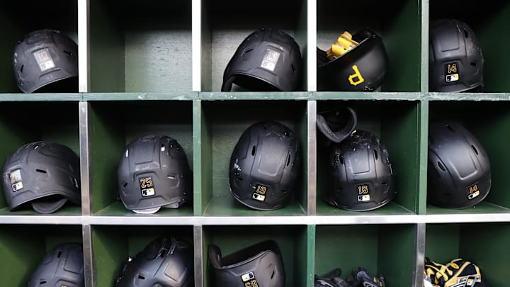 May 16, 2022; Chicago, Illinois, USA; Pittsburgh Pirates players helmets are seen in the dugout before a baseball game against the Chicago Cubs at Wrigley Field. Mandatory Credit: Kamil Krzaczynski-Imagn Images May 16, 2022; Chicago, Illinois, USA; Pittsburgh Pirates players helmets are seen in the dugout before a baseball game against the Chicago Cubs at Wrigley Field. Mandatory Credit: Kamil Krzaczynski-Imagn Images