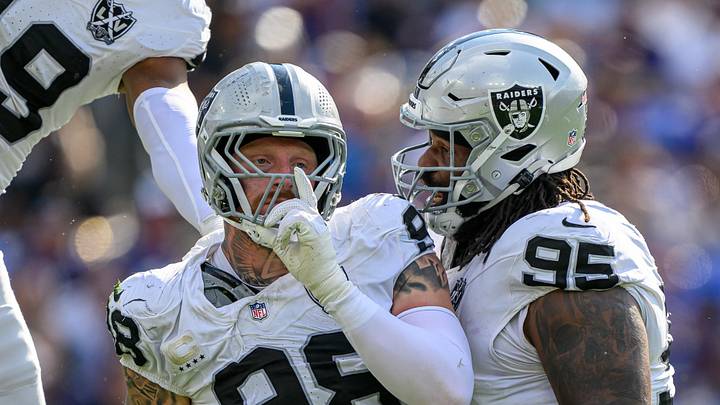 Sep 15, 2024; Baltimore, Maryland, USA; Las Vegas Raiders defensive end Maxx Crosby (98) celebrates with defensive tackle John Jenkins (95) after sacking Baltimore Ravens quarterback Lamar Jackson (not pictured) during the second half at M&T Bank Stadium. Mandatory Credit: Reggie Hildred-Imagn Images