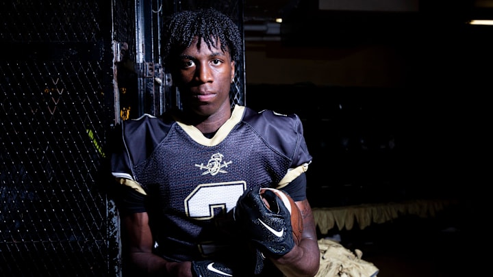 Radarious Jackson poses for a portrait in the football team's locker room at Sheffield High School