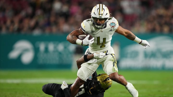 Dec 22, 2023; Tampa, FL, USA; UCF Knights defensive back Decorian Patterson (11) brings down Georgia Dec 22, 2023; Tampa, FL, USA; UCF Knights defensive back Decorian Patterson (11) brings down Georgia