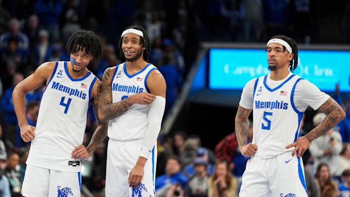 Memphis' PJ Haggerty (4), Colby Rogers (3) Dante Harris (5) smile and stand together as a teammate shoots a free throw during the game between Temple University and the University of Memphis at FedExForum in Memphis, Tenn., on Sunday, February 9, 2025.