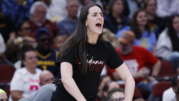Indiana Fever guard Caitlin Clark (22)reacts to a basket scored by a teammate against the Chicago Sky during the first half of a WNBA game at United Center.