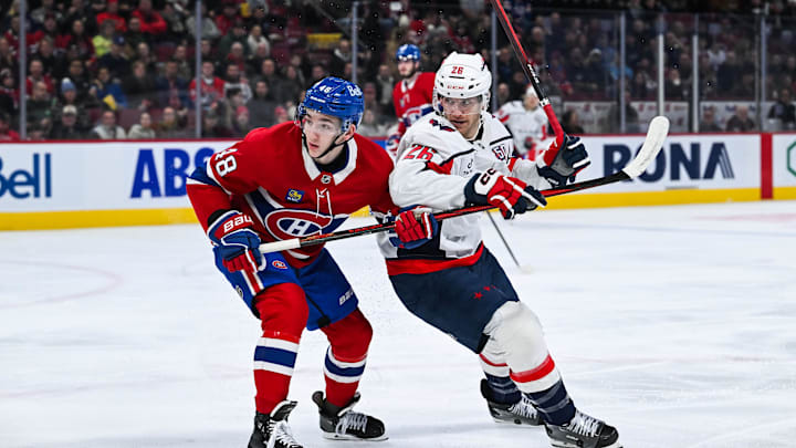 Dec 7, 2024; Montreal, Quebec, CAN; Montreal Canadiens defenseman Lane Hutson (48) battles for position against Washington Capitals center Nic Dowd (26) during the first period at Bell Centre. Mandatory Credit: David Kirouac-Imagn Images Dec 7, 2024; Montreal, Quebec, CAN; Montreal Canadiens defenseman Lane Hutson (48) battles for position against Washington Capitals center Nic Dowd (26) during the first period at Bell Centre. Mandatory Credit: David Kirouac-Imagn Images