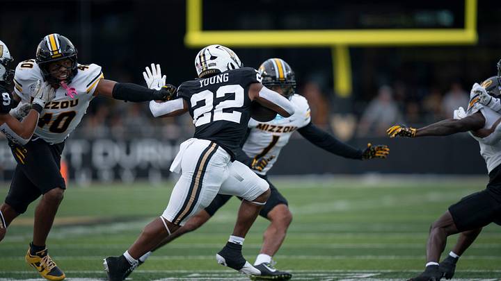 Vanderbilt's running back Makhilyn Young (22) breaks a tackle by Missouri's linebacker Josiah Trotter (40) in the second half of their game at FirstBank Stadium in Nashville, Tenn., Saturday, Oct. 25, 2025. Young was able to turn the corner against Missouri and score a long touchdown. Vanderbilt's running back Makhilyn Young (22) breaks a tackle by Missouri's linebacker Josiah Trotter (40) in the second half of their game at FirstBank Stadium in Nashville, Tenn., Saturday, Oct. 25, 2025. Young was able to turn the corner against Missouri and score a long touchdown.
