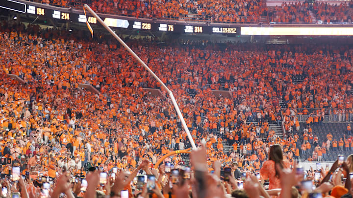 Oct 19, 2024; Knoxville, Tennessee, USA; Tennessee Volunteers fans tear down the goal posts after a victory over the Alabama Crimson Tide and at Neyland Stadium. Mandatory Credit: Randy Sartin-Imagn Images