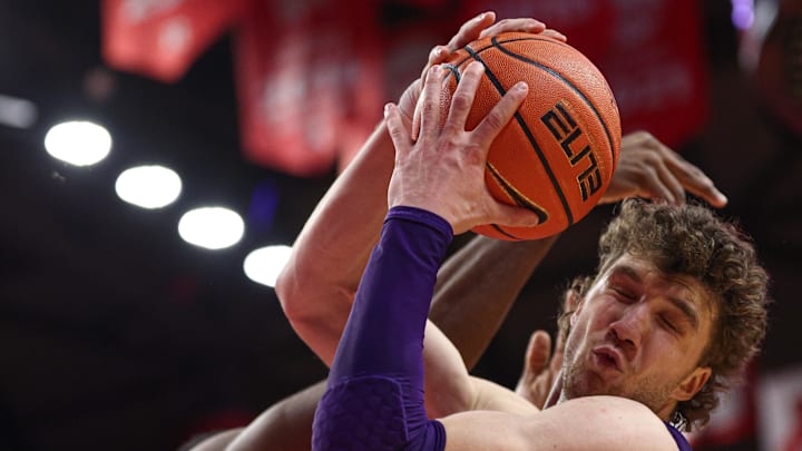 Jan 11, 2026; Piscataway, New Jersey, USA; Northwestern Wildcats forward Nick Martinelli (2) rebounds during the second half against the Rutgers Scarlet Knights at Jersey Mike's Arena. Mandatory Credit: Vincent Carchietta-Imagn Images