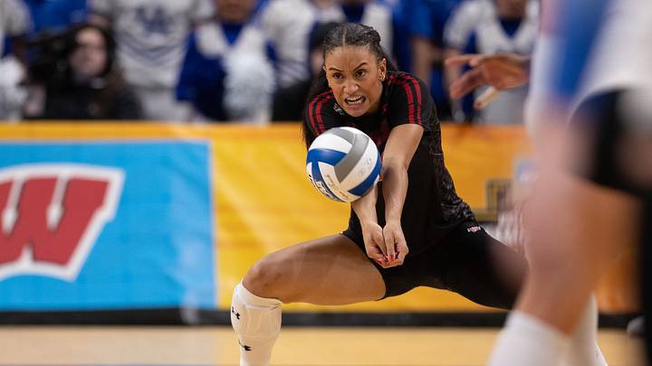 Dec 18, 2025; Kansas City, MO, USA;  Wisconsin Badgers outside hitter Grace Egan (32) hits the ball in a 2025 NCAA Women’s Volleyball Championship semifinal match at T-Mobile Center. Mandatory Credit: Kylie Graham-Imagn Images