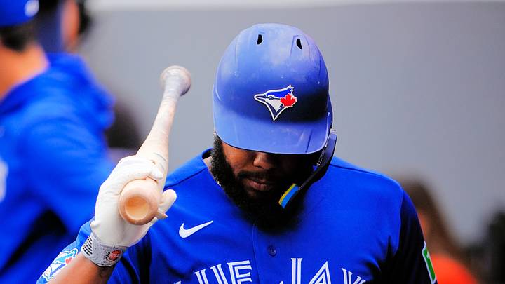 Sep 26, 2026; Toronto, Ontario, CAN;  Toronto Blue Jays designated hitter Vladimir Guerrero Jr. (27) reacts in the dugout after striking out against the Cincinnati Reds during the first inning at Rogers Centre.  Mandatory Credit: John E. Sokolowski-Imagn Images
