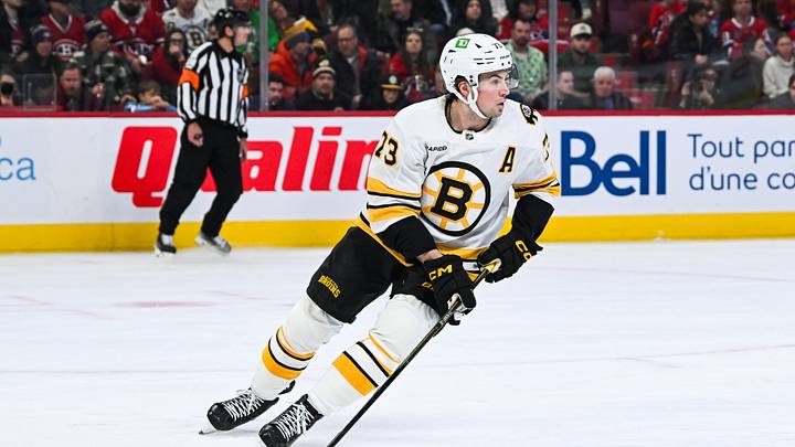 Mar 17, 2026; Montreal, Quebec, CAN; Boston Bruins defenseman Charlie McAvoy (73) plays the puck against the Montreal Canadiens during the second period at Bell Centre. Mandatory Credit: David Kirouac-Imagn Images