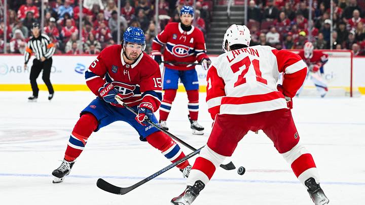Oct 10, 2026; Montreal, Quebec, CAN; Montreal Canadiens center Alex Newhook (15) plays the puck against Detroit Red Wings center Dylan Larkin (71) during the third period at Bell Centre. Mandatory Credit: David Kirouac-Imagn Images Oct 10, 2026; Montreal, Quebec, CAN; Montreal Canadiens center Alex Newhook (15) plays the puck against Detroit Red Wings center Dylan Larkin (71) during the third period at Bell Centre. Mandatory Credit: David Kirouac-Imagn Images