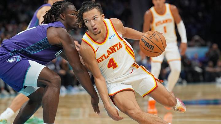 Oct 23, 2026; Charlotte, North Carolina, USA; Atlanta Hawks guard Kingston Flemings (4) drives to the basket against Charlotte Hornets guard Sion James (4) during the first half at the Spectrum Center. Mandatory Credit: Jim Dedmon-Imagn Images Oct 23, 2026; Charlotte, North Carolina, USA; Atlanta Hawks guard Kingston Flemings (4) drives to the basket against Charlotte Hornets guard Sion James (4) during the first half at the Spectrum Center. Mandatory Credit: Jim Dedmon-Imagn Images