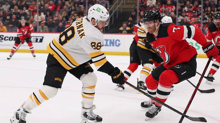 Mar 16, 2026; Newark, New Jersey, USA; Boston Bruins right wing David Pastrnak (88) and New Jersey Devils defenseman Dougie Hamilton (7) battle for the puck during the first period at Prudential Center. Mandatory Credit: Ed Mulholland-Imagn Images Mar 16, 2026; Newark, New Jersey, USA; Boston Bruins right wing David Pastrnak (88) and New Jersey Devils defenseman Dougie Hamilton (7) battle for the puck during the first period at Prudential Center. Mandatory Credit: Ed Mulholland-Imagn Images