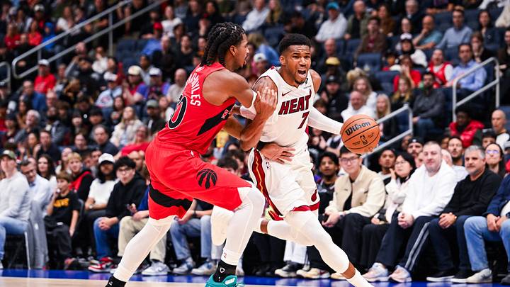 Oct 3, 2026; Quebec City, Quebec, CAN;  Miami Heat forward Giannis Antetokounmpo (7) dribbles the ball against Toronto Raptors forward Collin Murray-Boyles (30) during the second quarter at Videotron Centre.  Mandatory Credit: David Kirouac-Imagn Images
