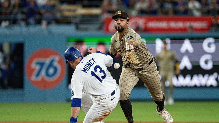 Jul 3, 2026; Los Angeles, California, USA; Los Angeles Dodgers third baseman Max Muncy (13) slides safely into second base as San Diego Padres shortstop Xander Bogaerts (2) misses an errant throw during the seventh inning at Dodger Stadium. Mandatory Credit: Jon Endow-Imagn Images Jul 3, 2026; Los Angeles, California, USA; Los Angeles Dodgers third baseman Max Muncy (13) slides safely into second base as San Diego Padres shortstop Xander Bogaerts (2) misses an errant throw during the seventh inning at Dodger Stadium. Mandatory Credit: Jon Endow-Imagn Images