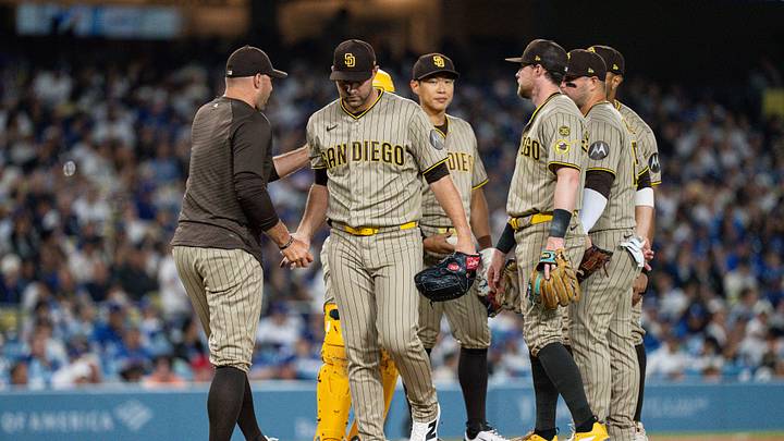 Jul 3, 2026; Los Angeles, California, USA; San Diego Padres manager Craig Stammen (14) takes the ball from pitcher Michael King (34) in the seventh inning against the Los Angeles Dodgers at Dodger Stadium. Mandatory Credit: Jon Endow-Imagn Images