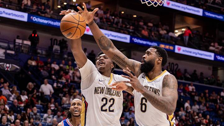 Feb 21, 2026; New Orleans, Louisiana, USA;  New Orleans Pelicans center Derik Queen (22) and center DeAndre Jordan (6) go for a loose ball against Philadelphia 76ers forward Jabari Walker (33) during the first half at Smoothie King Center. Mandatory Credit: Stephen Lew-Imagn Images