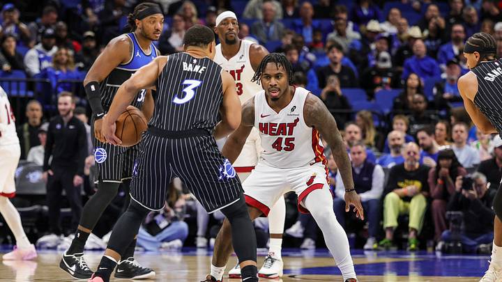 Dec 9, 2025; Orlando, Florida, USA; Miami Heat guard Davion Mitchell (45) defends Orlando Magic guard Desmond Bane (3) during the first quarter at Kia Center. Mandatory Credit: Mike Watters-Imagn Images