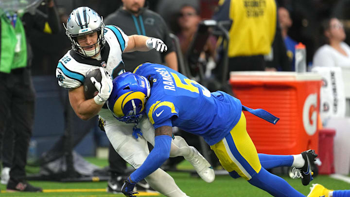 Oct 16, 2022; Inglewood, California, USA; Los Angeles Rams cornerback Jalen Ramsey (5) tackles Carolina Panthers running back Christian McCaffrey (22) in the fourth quarter at SoFi Stadium. Oct 16, 2022; Inglewood, California, USA; Los Angeles Rams cornerback Jalen Ramsey (5) tackles Carolina Panthers running back Christian McCaffrey (22) in the fourth quarter at SoFi Stadium.