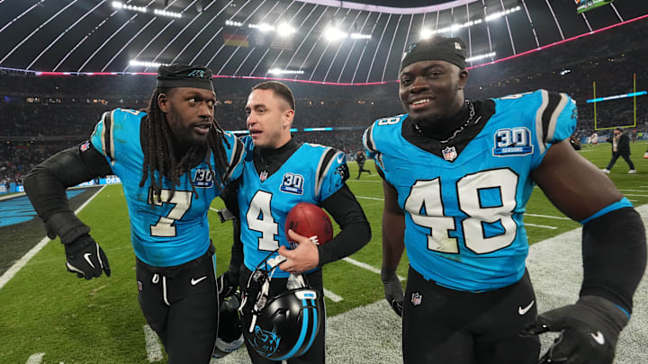 Nov 10, 2024; Munich, Germany; Carolina Panthers place kicker Eddy Pineiro (4) celebrates with linebacker Thomas Incoom (48) and linebacker Jadeveon Clowney (7) after kicking a 36-yard field goal in overtime against the New York Giants during the 2024 NFL Munich Game at Allianz Arena. Nov 10, 2024; Munich, Germany; Carolina Panthers place kicker Eddy Pineiro (4) celebrates with linebacker Thomas Incoom (48) and linebacker Jadeveon Clowney (7) after kicking a 36-yard field goal in overtime against the New York Giants during the 2024 NFL Munich Game at Allianz Arena.