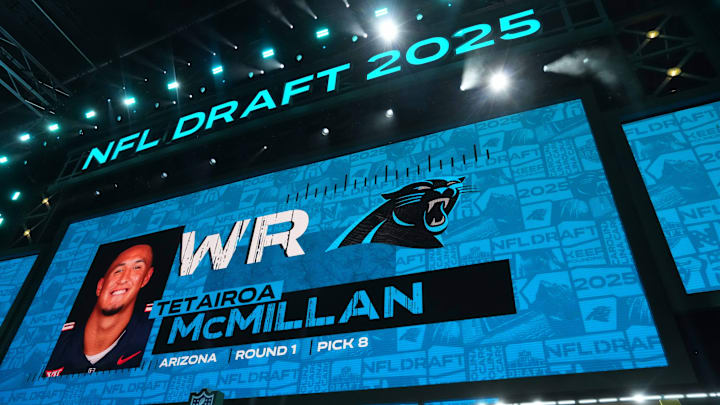 Apr 24, 2025; Green Bay, WI, USA; Arizona Wildcats receiver Tetairoa McMillan is selected as the No. 8 pick of the Carolina Panthers during the NFL Draft at Lambeau Field.