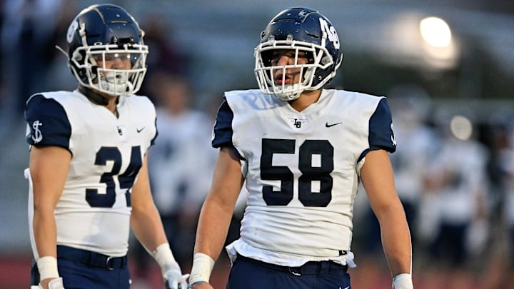 Lusiano Lopez stars for Lake Oswego in two sports — football and wrestling.