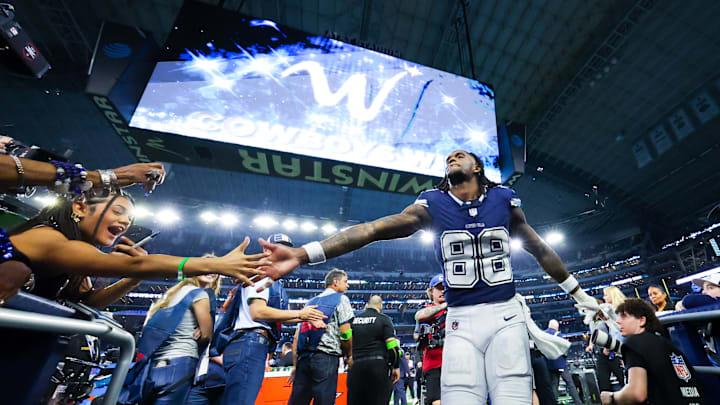 Dec 30, 2023; Arlington, Texas, USA;  Dallas Cowboys wide receiver CeeDee Lamb (88) celebrates with fans after the game against the Detroit Lions at AT&T Stadium. Mandatory Credit: Kevin Jairaj-USA TODAY Sports