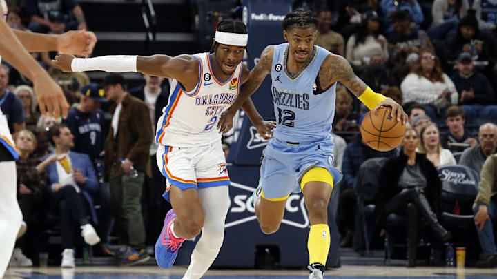 Memphis Grizzlies guard Ja Morant (12) pushes the ball up the court as Oklahoma City Thunder guard Shai Gilgeous-Alexander (2) defends during the second half at FedExForum. Mandatory Credit: Petre Thomas-Imagn Images Memphis Grizzlies guard Ja Morant (12) pushes the ball up the court as Oklahoma City Thunder guard Shai Gilgeous-Alexander (2) defends during the second half at FedExForum. Mandatory Credit: Petre Thomas-Imagn Images