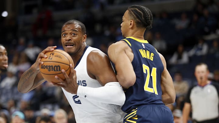 Oct 8, 2023; Memphis, Tennessee, USA; Memphis Grizzlies forward Xavier Tillman (2) drives toward the basket as Indiana Pacers guard Isaiah Wong (21) defends during the second half at FedExForum. Mandatory Credit: Petre Thomas-Imagn Images